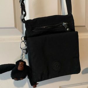 Super cute, mini Crossbody purse with lots of storage.